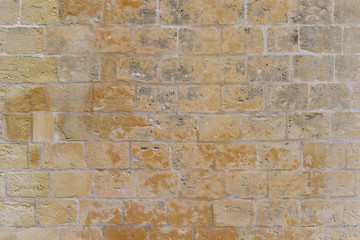 Old building bricks wall made of limestone