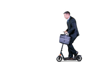 Fototapeta na wymiar Businessman riding an electric scooter on studio