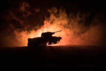 War Concept. Military silhouettes fighting scene on war fog sky background, Silhouette of armored...