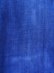 Closeup jeans fabric texture. Denim jeans background.