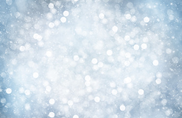 Decorative Christmas background with bokeh lights and snowflakes.
