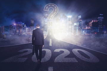 Businessman with number 2020 and question mark