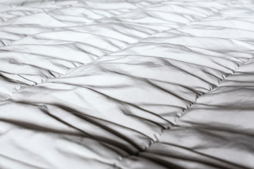 White crumpled blanket in the bedroom