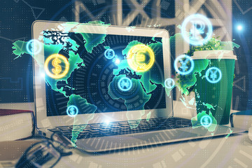 Forex market chart hologram and personal computer background. Multi exposure. Concept of investment.