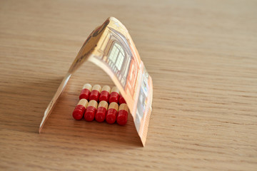 pills with euro bill health spending concept