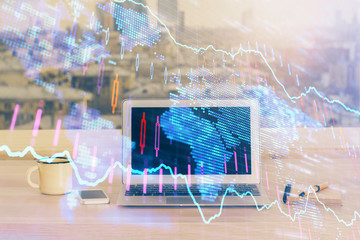 Forex market chart hologram and personal computer background. Multi exposure. Concept of investment.