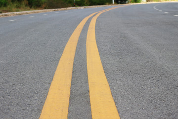 Obraz premium Abstract black asphalt winding Road transport with white and yellow line
