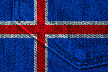 Fototapeta na wymiar beautiful photo colored iceland colored national flag of modern state on textured fabric, concept of tourism, emigration, economy and politics, closeup