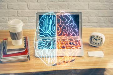 Double exposure of table with computer and brain hologram. Data innovation concept.