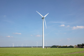 Fototapeta premium Wind turbines in a field in Almere, Netherlands, using wind to make electricity.