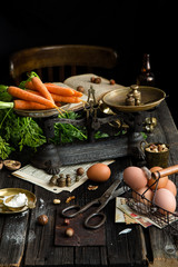 ripe tasty carrots with leaves on vintage scales