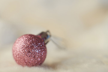 Christmas outdoor background with fir tree branches, decorations and blurred lights on back