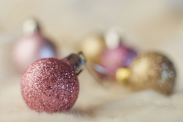 Christmas outdoor background with fir tree branches, decorations and blurred lights on back