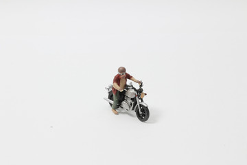 Mini Figure Ride motocross on the white background