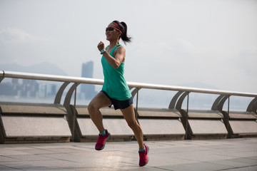 Healthy lifestyle woman runner running at Hong kong