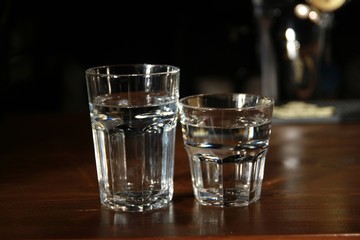 glass of water on black background