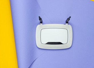 Wi-fi router on wrapped paper background. Pastel color trend, minimalistic still life. Modern...
