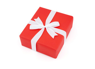 Red gift box and white ribbon in season Christmas and new year isolated on white background, luxury present for birthday or anniversary with surprise in package for happy, holiday concept.