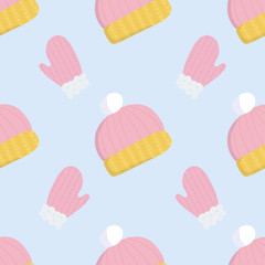 Cartoon pattern with wool winter pink and yellow hat on soft blue backdrop for wallpaper design, wrapping paper, fabric, textile. Seamless vector background.