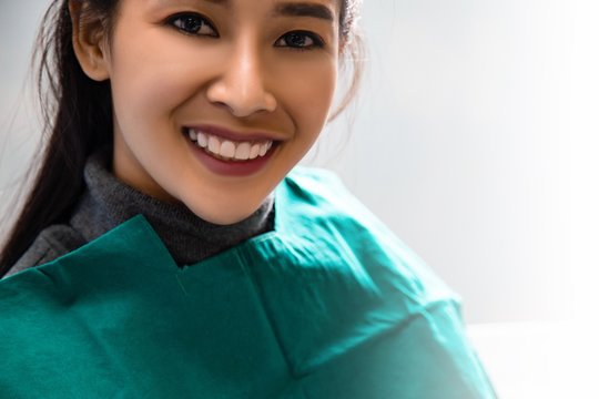 Dentist examining mouth teeth of beautiful young Asian woman in hospital clinic dental health care beautify oral hygiene concept