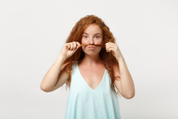 Young funny redhead woman girl in casual light clothes posing isolated on white wall background. People lifestyle concept. Mock up copy space. Having fun, fooling around, holding hair like mustache.