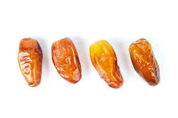 date palm fruits on white background, close up