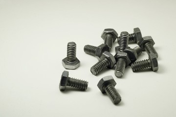 Metal bolts on white background.