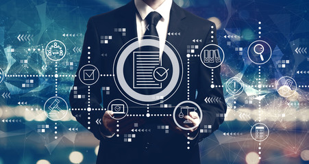 Compliance theme with businessman holding a tablet computer