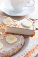 Banana cheesecake without baking on a wooden table, selective focus