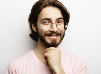 Headshot of satisfied cheerful man wearing glasses, glad to find suitable well paid job