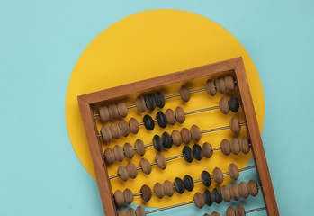 Retro abacus on a pastel color background. Top view. Minimalism