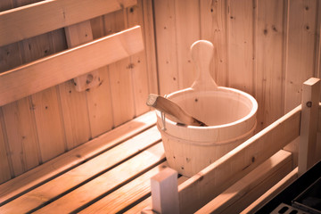 Fototapeta na wymiar wood bucket and spoon in sauna