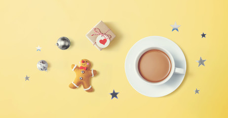 Christmas ornaments with a cup of coffee - flat lay