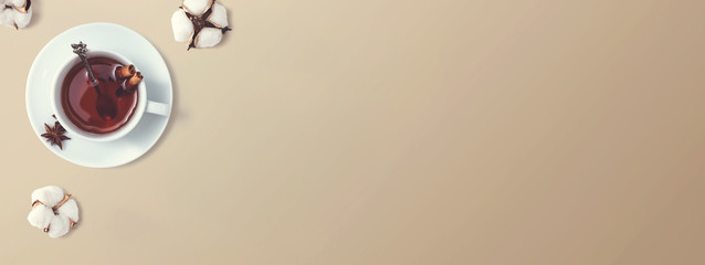 Black tea with cinnamon sticks and star anise - overhead view