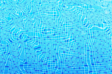Ripples on the surface of the water in a blue swimming pool