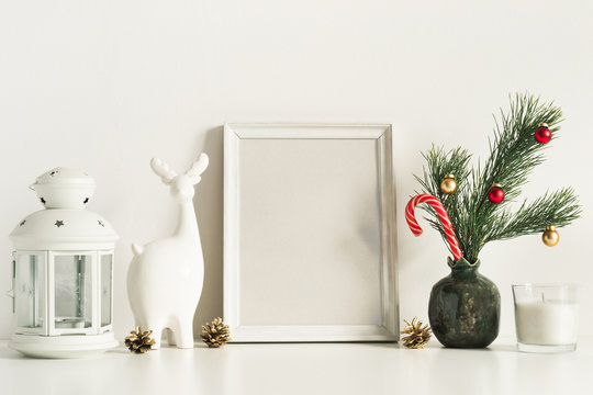 White Composition with little Christmas tree in vase, deer and candles. Front view mockup template