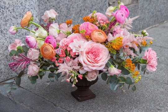 Wedding designer soft red pink orange bouquet of florist with different flowers, peony and roses 
