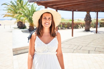 Young beautiful woman smiling happy enjoying sunny day of summer at hotel resort on holidays