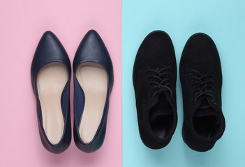 Leather high heel shoes and boots on a colored pastel background. Minimalistic fashion concept. Top view