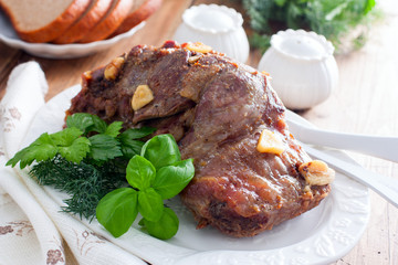 Baked beef filet whole piece on a wooden table, horizontal