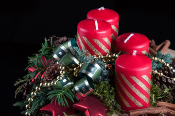 Advent candles on a black background