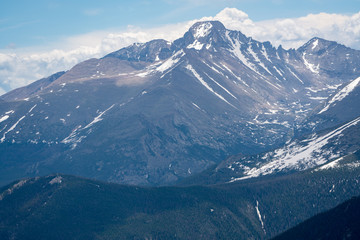 mountains in the Rockies in the summer with snow of peak