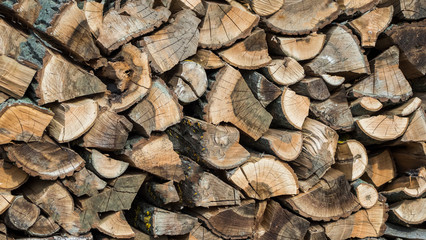 Woodpile of wood, fuel for the winter neatly folded