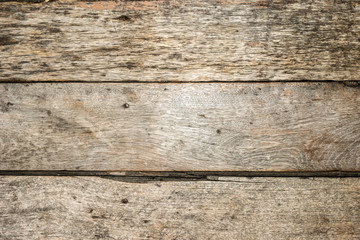 Old patterned wooden boards are dirty. View from above Taken very close, can see the wood texture in detail