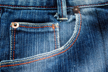 Close up of Blue jeans,Detail of vintage jeans texture with pocket studs and stitch with selective focus.