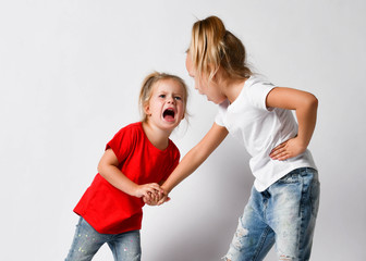 Two girls friends, sisters are fighting, crying, yelling, argue, hurt each other, abuse. Family...