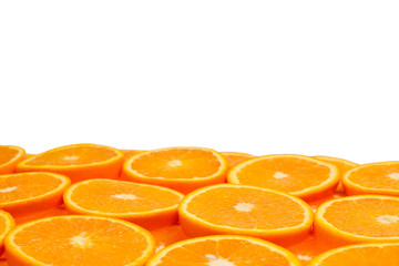Slices of oranges as a background, top view.