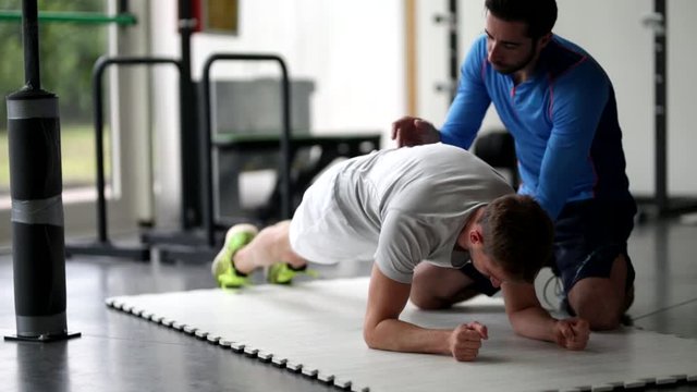 Personal Trainer with young man