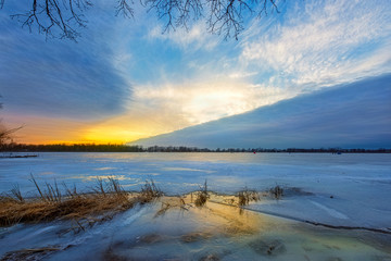 sunset over the lake in winter