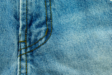 Close up of Blue jeans,Detail of vintage jeans texture with pocket studs and stitch with selective focus.